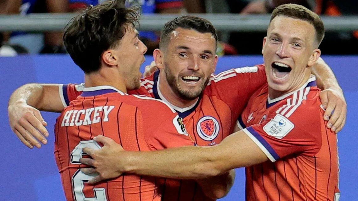 McGinn beaming with… McGinn beaming with…
